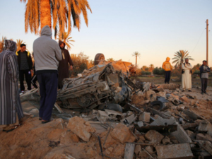 Sabratha residents survey damage in their city. (Twitter)
