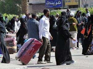 عمال ينتظرون ترحيلهم في العاصمة الرياض/AFP