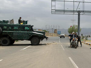 Yemeni soldiers search a motorbike at a checkpoint on a street leading to the US embassy compound in Sanaa (AFP/ MOHAMMED HUWAIS)