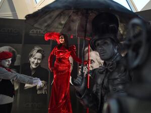A woman poses for photographs at an invitation-only screening of Black Panther.
(Fayez Nureldine / AFP Photo)