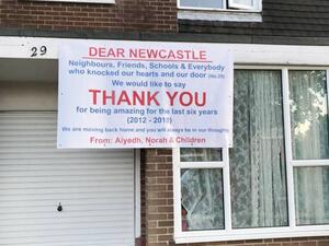 A banner hangs outside the house of Aiyedh Al-Shahrani. (Twitter)