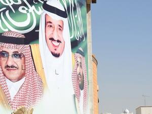 A banner Saudi King Salman bin Abdulaziz, Crown Prince and Interior Minister Mohammed Bin Nayef in Riyadh (AFP)