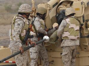 Saudi soldiers load an artillery piece at a position close to the Saudi-Yemeni border. (AFP/File)