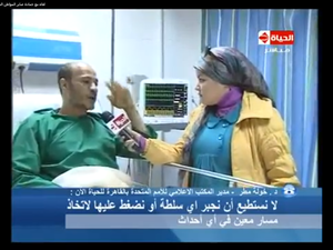 Hamda says it was those pesky protestors that stripped him bare, not the sweet policeman.