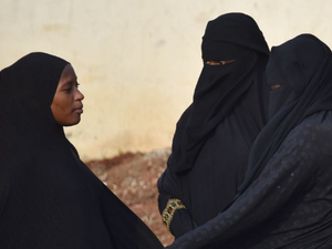 Women in the city of Abijdan in the Ivory Coast wearing face veils and hijabs in July 2015. (AFP Photo/Issouf Sanogo)