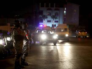 Security forces stand guard outside the Israeli embassy in Amman, Jordan (AFP/File Photo)	