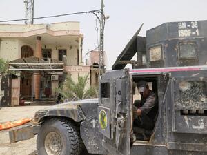 Iraqi counter-terrorism forces drive through a southern neighborhood in Fallujah. (AFP/Jean Marc Mojon)