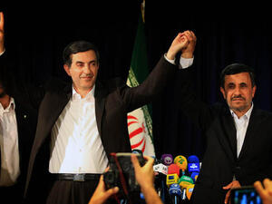 Iran President Mahmoud Ahmadinejad poses with close aide Esfandiar Rahim Mashaie after registering as a candidate in the presidential elections (AFP)