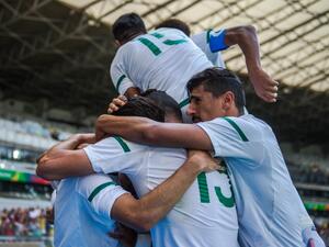 Algeria's footballers celebrate the goal of Mohammed Benkablia during the Rio 2016 Olympic Games first round Group D men's football match Algeria vs Portugal at the Mineirao stadium in Belo Horizonte, Brazil on August 10, 2016.
GUSTAVO ANDRADE / AFP