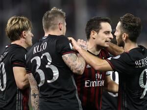 AC Milan's Giacomo Bonaventura (2nd from right) celebrates with teammates scoring a goal against Juventus' team during the Italian Super Cup final match between AC Milan and Juventus in Doha on December 23, 2016.
KARIM JAAFAR / AFP