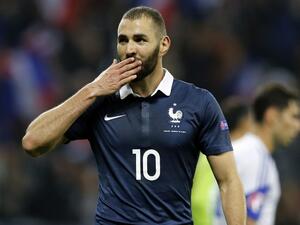 (FILES) This file photo taken on October 09, 2015 shows French forward Karim Benzema celebrating after scoring a goal during the friendly football match between France and Armenia on October 8, 2015. The judicial review of Karim Benzema, indicted in the sex-tape blackmailing affair against Mathieu Valbuena, was lifted on March 11, 2016, by the Versailles Court of Appeal, opening the way to its come-back in the French national team for Euro 2016.