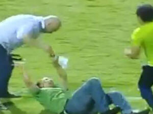 A still from the post-match video as Hossam Hassan (L) assaulted the policeman following an Egyptian Premier League game 