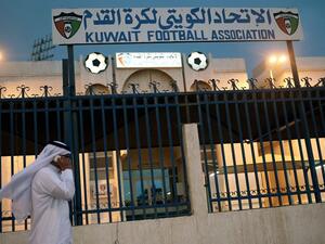 A man walks past the Kuwaiti Football Association (KFA)'s headquarters on October 17, 2015, in Kuwait City. The KFA was suspended by FIFA on October 16, 2015, for government interference, a decision which could impact the team's hopes of qualifying for the 2018 World Cup. AFP PHOTO / YASSER AL-ZAYYAT
YASSER AL-ZAYYAT / AFP