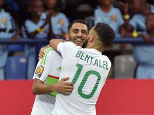 Algeria's forward Riyad Mahrez (back) celebrates with Algeria's midfielder Nabil Bentaleb after scoring a goal during the 2017 Africa Cup of Nations group B football match between Algeria and Zimbabwe in Franceville on January 15, 2017.
KHALED DESOUKI / AFP