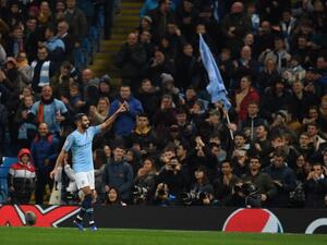 Manchester City's Algerian midfielder Riyad Mahrez celebrates after scoring their fifth goal during a UEFA Champions League group F football match between Manchester City and Shakhtar Donetsk at the Etihad stadium in Manchester, northwest England on November 7, 2018.
Paul ELLIS / AFP