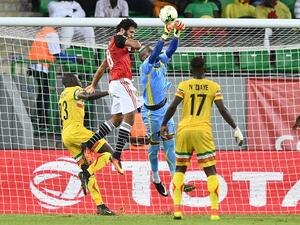 Mali's goalkeeper Oumar Sissoko (C-R) saves a shot on goal by Egypt's forward Marwan Mohsen (C-L) next to Mali's defender Ousmane Coulibaly (L) and Mali's midfielder Mamoutou N'Diaye (R) during the 2017 Africa Cup of Nations group D football match between Mali and Egypt in Port-Gentil on January 17, 2017.
Justin TALLIS / AFP