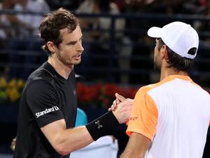 World number one Andy Murray (L) of Great Britain embraces Spain's Fernando Verdasco following their ATP final tennis match which Murray won, concluding the Dubai Duty Free Championships on March 4, 2017.
KARIM SAHIB / AFP