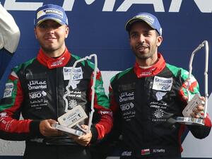 Oman Racing’s Ahmad Al Harthy, right, and Tom Jackson celebrate on the podium. Photo - Supplied 