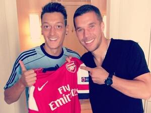 Arsenal's Lukas Podolski hits back at Mesut Ozil critics