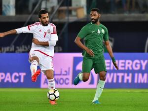 Saudi's Mohammed Al-Khabrani (R) vies for the ball with Emirates' Ali Mabkhout during the 2017 Gulf Cup of Nations football match between UAE and Saudi Arabia at the Sheikh Jaber al-Ahmad Stadium in Kuwait City on December 25, 2017.
GIUSEPPE CACACE / AFP