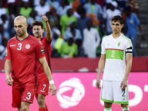 Tunisia's midfielder Youssef Msakni (L) gives a thumbs-up next to Algeria's defender Aissa Mandi at the end of the 2017 Africa Cup of Nations group B football match between Algeria and Tunisia in Franceville on January 19, 2017.
KHALED DESOUKI / AFP