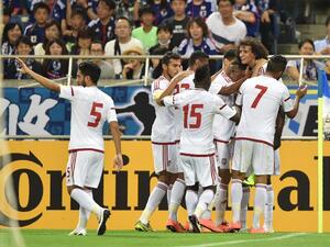 Players of United Arab Emirates (UAE) celebrate their winning goal against Japan during their football match in the final round of Asian qualifiers for the 2018 World Cup at Saitama Stadium on September 1, 2016. KAZUHIRO NOGI / AFP