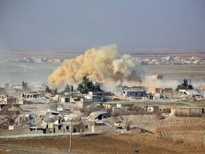 Smoke rises from buildings in the area of Tal Sharba following government air strikes on the outskirts of the northern Syrian city of Aleppo. (AFP/George Ourfalian)