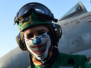 A sailor stands near an An F/A-18E Super Hornet on the US navy's super carrier USS Dwight D. Eisenhower in the Mediterranean Sea. Air Wings embarked aboard conducted strikes against the terrorist group ISIL in Libya, Iraq and Syria. (AFP/File)