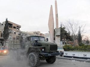 Syrian pro-government forces drive inside a military vehicle after capturing the town of Nabak, north of Damascus, near the border with Lebanon in the Qalamoun region, on December 9, 2013. [AFP]