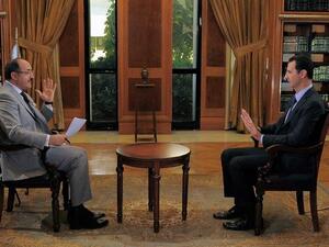 Assad gives interview on upcoming meetings and possibility for re-election. [AFP]