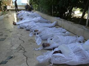 A handout image released by the Syrian opposition's Shaam News Network shows bodies of children wrapped in shrouds as Syrian rebels claim they were killed in a toxic gas attack by pro-government forces in eastern Ghouta, on the outskirts of Damascus on August 21, 2013. AFP PHOTO / HO / SHAAM NEWS NETWORK