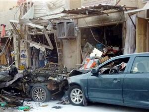 Aftermath of an August 2013 car bomb in Baghdad. Sunday's attacks killed over one dozen and injured over 50.  (AFP/File)