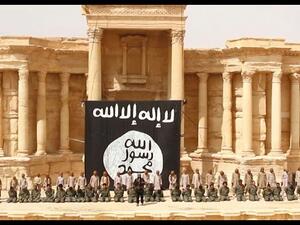 This video screenshot shows a mass public execution of several dozen Syrian government soldiers in the ancient Roman theater of Syria's Palmyra, most likely soon after Daesh's May 21 takeover of the city.  (AFP/File)