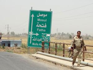 An Iraqi soldier travels away from Mosul after Daesh's takeover of the city in June 2014.  (AFP/Marwan Ibrahim)