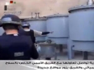  An image grab taken from Syrian television on October 19, 2013 shows inspectors from the Organization for the Prohibition of Chemical Weapons (OPCW) at work at an undisclosed location. (Image credit: AFP)