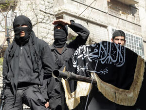 Members of jihadist group Al-Nusra Front take part in a parade calling for the establishment of an Islamic state in Syria. (Image credit: AFP)