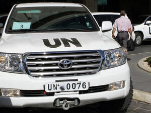 United Nations vehicles are seen leaving the hotel in Damascus on October 3, 2013. (Image credit: AFP)