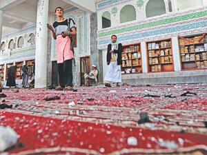 People inspect damage following a string of Daesh-claimed attacks in March on Shiite mosques in Yemen's capital Sanaa. Friday's attack injured 13, say security sources.  (AFP/File)