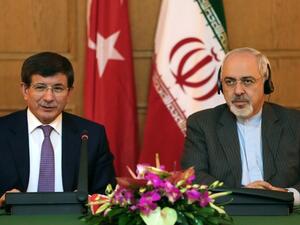 Iranian Foreign Minister Mohammad Javad Zarif  gives a joint press conference with his Turkish counterpart Ahmet Davutoglu on November 27, 2013. [Atta Kenare/AFP]