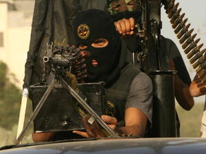 Dummies pose with guns when telling police they were just doing aid work in Syria (AFP/ File).