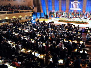 Delegates applaud following the vote which admitted Palestinians to enter UNESCO as a full member on October 31, 2011 at the headquarters of the organization in Paris. [Getty Images]