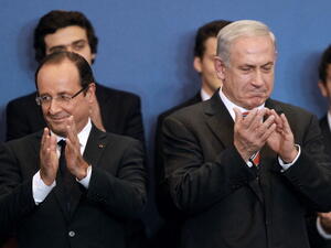 French President Francois Hollande  and Israeli Prime Minister Benjamin Netanyahu. {Bob Edme/Getty Images]