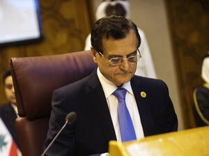 Lebanon foreign affairs minister Adnan Mansour reads during a meeting of the Arab League with Arab countries Foreign ministers on Syria on September 1, 2013 at the body's Cairo headquarters. [Getty Images]