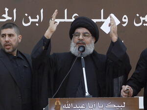 The head of Lebanon's militant Shiite Muslim movement Hezbollah, Hassan Nasrallah gives a speech during a massive Shiite Muslim commemoration in southern Beirut on November 14, 2013. [Getty Images]