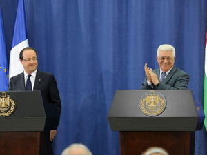 Palestinian President Mahmoud Abbas and French President Francois Hollande hold a joint press conference on November 18, 2013 in Ramallah, West Bank. [Thaer Ghanaim/GPO via Getty Images]