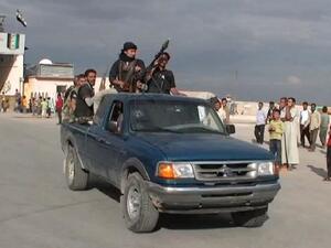 An image grab taken from a video uploaded on YouTube on September 20, 2013 shows alleged Northern Storm brigade members, loyal to the Free Syrian Army. [AFP PHOTO / YOUTUBE]
