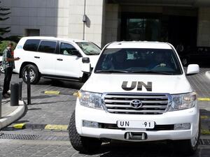 A convoy of United Nations vehicles carrying chemical weapons experts, leaves a hotel in the Syrian capital Damascus. [AFP]