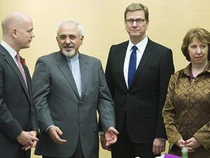 William Hague, Iranian foreign minister Mohammad Javad Zarif, Germany's foreign minister Guido Westerwelle and EU foreign affairs chief Catherine Ashton at the talks in Geneva. [Jean-Christophe Bott/AP]