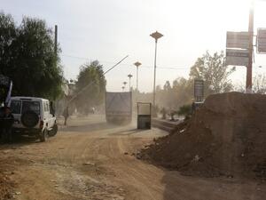 Aid convoys prepare to enter Moadimayet al-Sham, a rebel-held town near the Syrian capital Damascus, on February 17, 2016, during an operation to deliver aid to thousands of besieged Syrians.  (AFP/Louai Besharra)