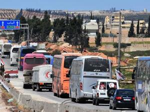A convoy transporting Jaish al-Islam fighters and their families from the town of Douma to the northern Syrian city of Aleppo. (AFP/ File)